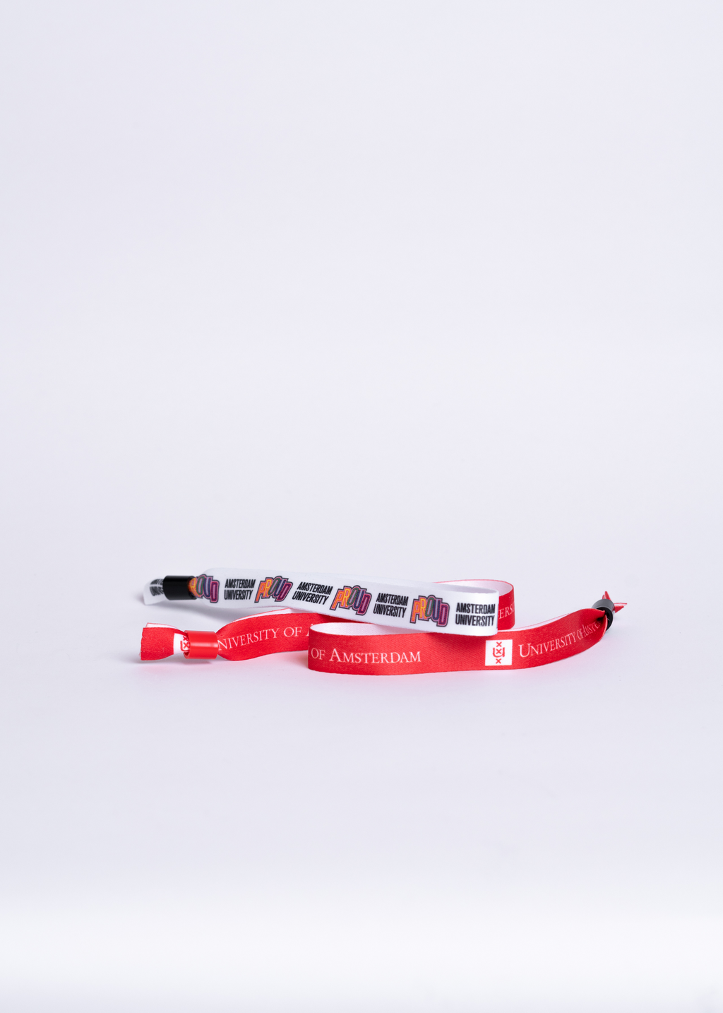 Wristbands with the University of Amsterdam and Proud logo