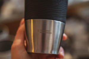 Stainless steel thermos cup with the University of Amsterdam logo